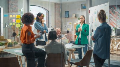 Female Business Coach for Company Management Explains How to Tra